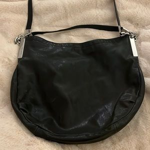 Micheal Kors black soft leather boho purse in really good condition.